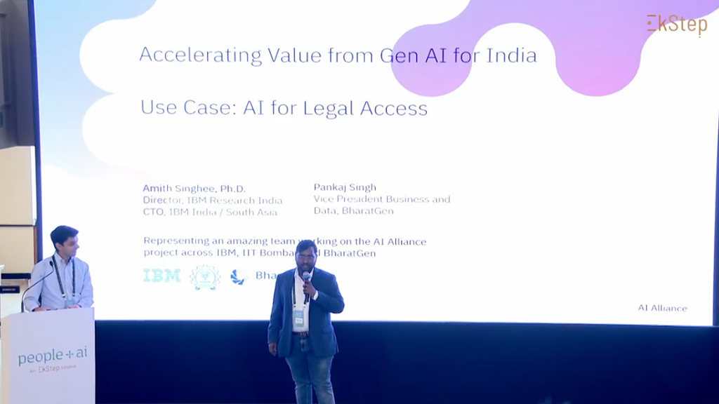 Amit Singhee (IBM) and Pankaj Singh (BharatGen) demo InstructLab AI legal access at People+ai Mela, showing multilingual Bharatiya Nyaya Samhita queries.