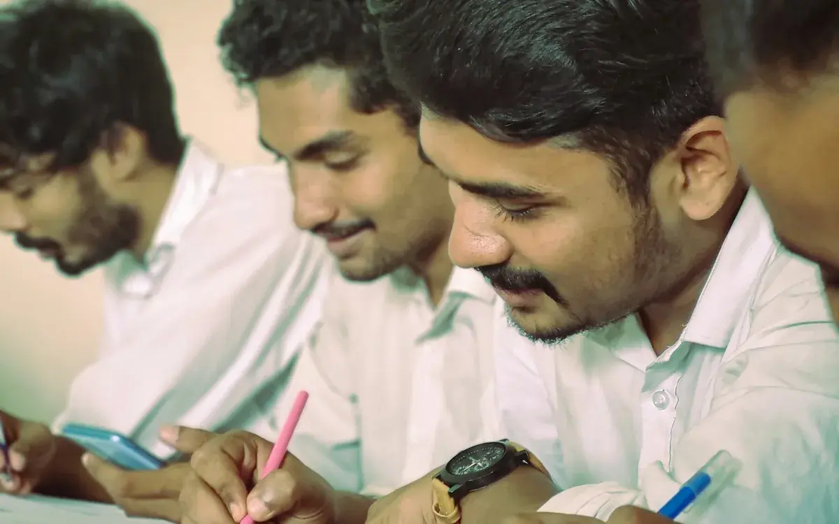 Students writing in a classroom
